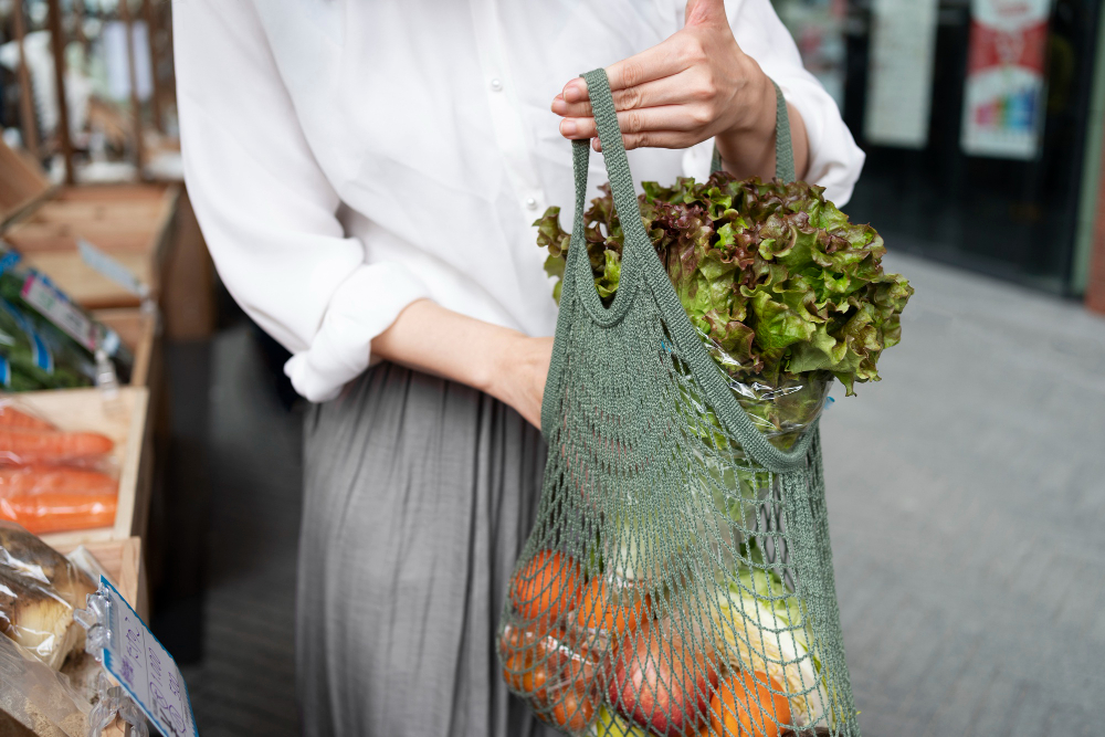front view woman carrying groceries tote bag